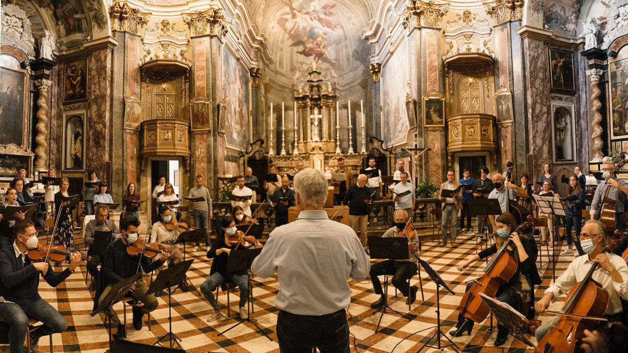 Choir and Orchestra in Church (Photo by Andrea Zanenga on Unsplash)